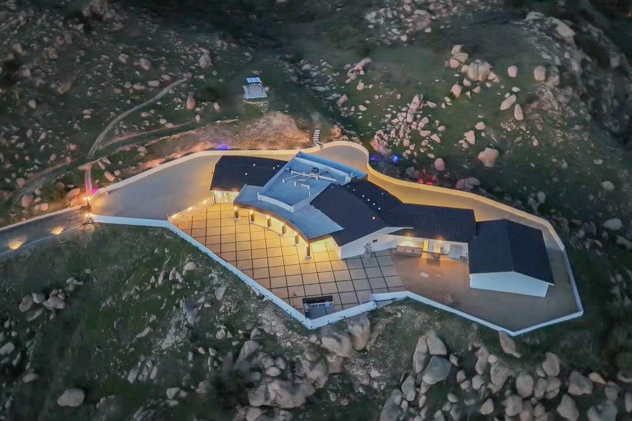 Aerial view of Golden Ridge Estate, a modern architectural compound on a Bell Canyon hilltop at twilight